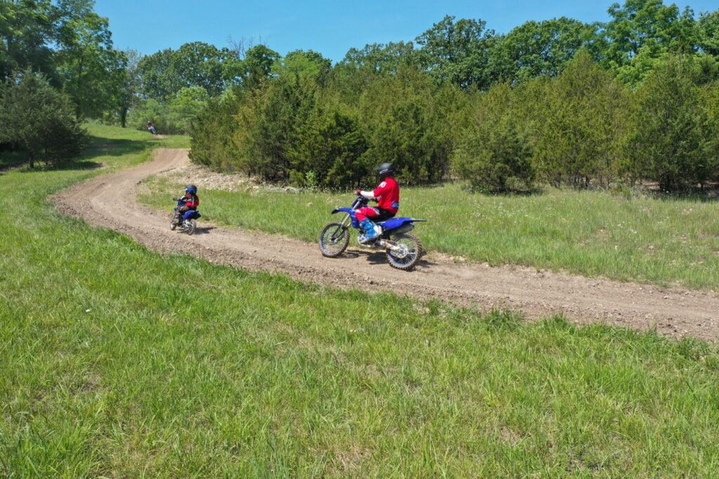 Blue and his daughter Arys riding a motocross track near Sedalia, MO